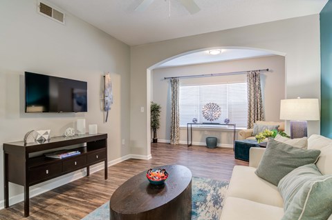 a living room with a couch and a tv